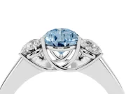 Fancy Blue Three-Stone Pear Cut Diamond Ring Set in Platinum with Matching Prong Settings and Plain Band