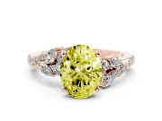 Fancy Yellow Oval Cut Diamond Solitaire Ring Set in Rose gold with Marquise Twist Band and Prong Setting