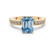 Fancy Blue Emerald Cut Diamond Solitaire Ring Set in Yellow gold with Slim Pavé Band and Prong Setting
