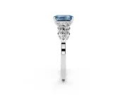 Fancy Blue Emerald Cut Diamond Cluster Engagement Ring Set in Platinum with Pavé Band and Prong Setting