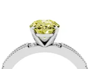 Fancy Yellow Oval Cut Diamond Solitaire Ring Set in Silver with Slim Pavé Band and Prong Setting