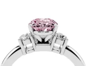 Fancy Pink Three-Stone Oval Cut Diamond Ring Set in White gold with Prong Setting and Plain Band