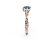Fancy Blue Heart Cut Diamond Solitaire Engagement Ring Set in Rose gold with Twisted Pavé Band and Prong Setting
