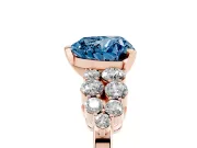 Fancy Blue Heart Cut Diamond Cluster Engagement Ring Set in Rose gold with Pavé Band and Prong Setting