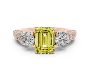 Fancy Yellow Emerald Cut Diamond Three-Stone Ring Set in Rose gold with Round Side Stones and Pavé Band