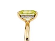 Fancy Yellow Emerald Cut Diamond Solitaire Ring Set in Yellow gold with Thin Band and Prong Setting
