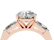 Round Cut Diamond Solitaire Ring Set in Rose gold with Tapered Baguette Side Stones and Prong Setting