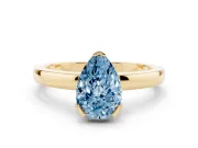 Fancy Blue Pear Cut Diamond Solitaire Ring Set in Yellow gold with Prong Head and Smooth Polished Band