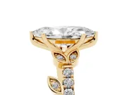Marquise Cut Diamond Solitaire Leaf-Inspired Ring Set in Yellow gold with Pavé Band and Prong Setting