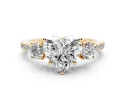 Heart Cut Diamond Three-Stone Ring Set in Yellow gold with Pavé Band and Graduated Sides