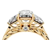 Emerald Cut Diamond Three-Stone Ring Set in Yellow gold with Braided Band