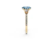 Fancy Blue Oval Cut Diamond Three-Stone Ring Set in Yellow gold with Pavé Band and Graduated Sides