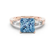Fancy Blue Princess Cut Diamond Solitaire Ring Set in Rose gold with Tapered Baguette Side Stones and Prong Setting