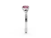 Fancy Pink Heart Cut Diamond Solitaire Ring Set in Platinum with Tapered Baguette Side Stones and Prong Setting