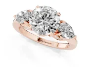 Round Cut Diamond Three-Stone Ring Set in Rose gold with Pear Side Stones