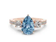 Fancy Blue Three-Stone Pear Cut Diamond Pavé Band Ring Set in Rose gold with Prong Setting