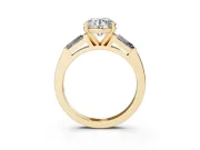 Round Cut Diamond Solitaire Ring Set in Yellow gold with Tapered Baguette Side Stones and Prong Setting