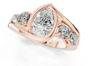 Pear Cut Diamond Bezel Bypass Ring Set in Rose gold with Round Accents