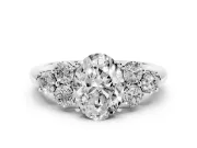 Oval Cut Diamond Cluster Ring Set in Silver with Round Accent Stones and Prong Setting on a Plain Band