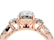 Emerald Cut Diamond Three-Stone Ring Set in Rose gold with Pavé Split Shank and Prong Setting