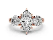 Marquise Cut Diamond Three-Stone Ring Set in Rose gold with Prong Setting and Classic Band
