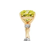 Fancy Yellow Cushion Cut Diamond Solitaire Ring Set in Yellow gold with Bezel Set Side Stones and Prong Setting