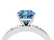 Fancy Blue Cushion Cut Diamond Solitaire Ring Set in White gold with Channel-Set Baguette Band and Prong Setting