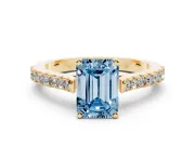 Fancy Blue Emerald Cut Diamond Solitaire Engagement Ring Set in Yellow gold with Delicate Pavé Band and Prong Setting