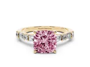 Fancy Pink Cushion Cut Diamond Solitaire Set in Yellow gold with Side Baguettes and Channel Set Band