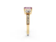 Fancy Pink Emerald Cut Diamond Three-Stone Ring Set in Yellow gold with Round Side Stones and Pavé Band
