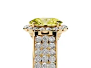 Fancy Yellow Oval Cut Diamond Halo Ring Set in Yellow gold with Pavé Band and Raised Center Setting