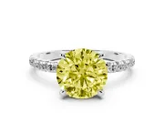 Fancy Yellow Round Cut Diamond Brilliant Solitaire Ring Set in Silver with Pavé Band and Prong Setting