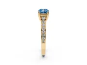 Fancy Blue Cushion Cut Diamond Solitaire Pavé Engagement Ring Set in Yellow gold with Prong Setting