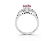 Fancy Pink Three-Stone Heart Cut Diamond Ring Set in Platinum with Pear Side Stones and Prong Setting