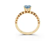 Fancy Blue Oval Cut Diamond Solitaire Engagement Ring Set in Yellow gold with Bezel Accents on Beaded Band