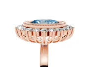 Fancy Blue Oval Cut Diamond Halo Ring Set in Rose gold with Milgrain Edge and Round Prong Setting