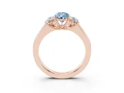 Fancy Blue Three-Stone Pear Cut Diamond Ring Set in Rose gold with Matching Prong Settings and Plain Band