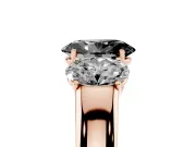 Fancy Black Three-Stone Oval Cut Diamond Ring Set in Rose gold with Matching Prong Settings and Plain Band