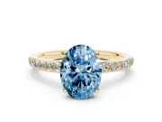 Fancy Blue Oval Cut Diamond Pavé Band Ring Set in Yellow gold with Prong-Set Center Stone