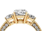 Cushion Cut Diamond Three-Stone Ring Set in Yellow gold with Round Side Stones and Pavé Band