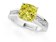 Fancy Yellow Cushion Cut Diamond Solitaire Ring Set in Silver with Channel-Set Band and Prong Setting