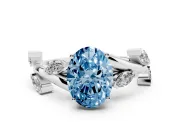 Fancy Blue Oval Cut Diamond Solitaire Ring Set in Silver with Twisted Marquise Accent Band