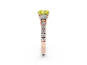 Fancy Yellow Cushion Cut Diamond Three-Stone Ring Set in Rose gold with Round Side Stones and Delicate Pavé Band