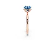 Fancy Blue Round Cut Diamond Solitaire Engagement Ring Set in Rose gold with Prong Setting and Polished Band
