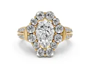 Pear Cut Diamond Halo Engagement Ring Set in Yellow gold with Split Shank and Prong Setting