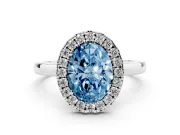Fancy Blue Oval Cut Diamond Halo Solitaire Ring Set in White gold with Pavé Band and Prong Setting