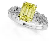 Fancy Yellow Emerald Cut Diamond Cluster Engagement Ring Set in White gold with Pavé Band and Prong Setting