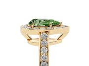 Fancy Green Pear Cut Diamond Halo Pavé Engagement Ring Set in Yellow gold with Bezel Setting