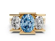 Oval Channel-Set Three Stone Engagement Ring Setting for a Fancy Blue Lab-Grown Diamond | Wide Flat Band | Yellow Gold