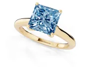 Fancy Blue Princess Cut Diamond Solitaire Ring Set in Yellow gold with Cathedral Band and Prong Setting